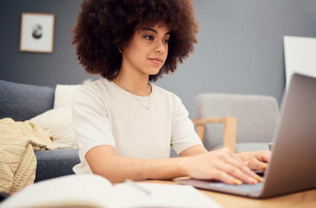 Laptop, planning and business woman or entrepreneur writing notes, idea brainstorming and schedule planner for marketing management.