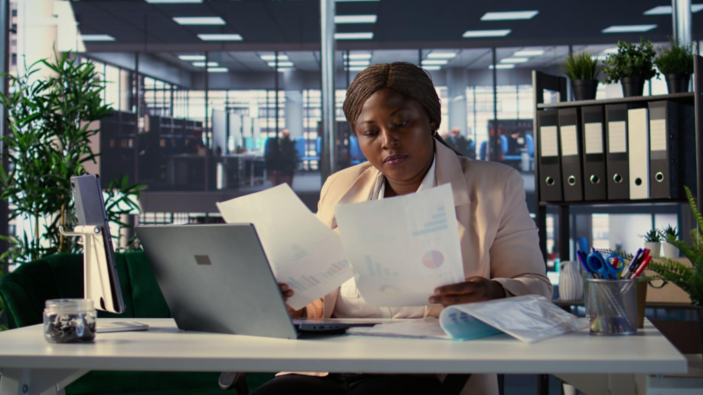 Successful businesswoman analyzes data and market trends on laptop