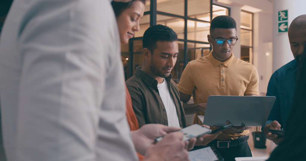 Team, tech and meeting with business people in office for research, app developer and project launch.