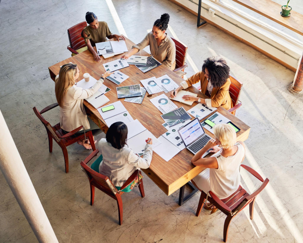Business meeting, planning and people above with digital marketing strategy, data analytics and graphs or charts review. Employees with startup analysis, brainstorming ideas and teamwork in works